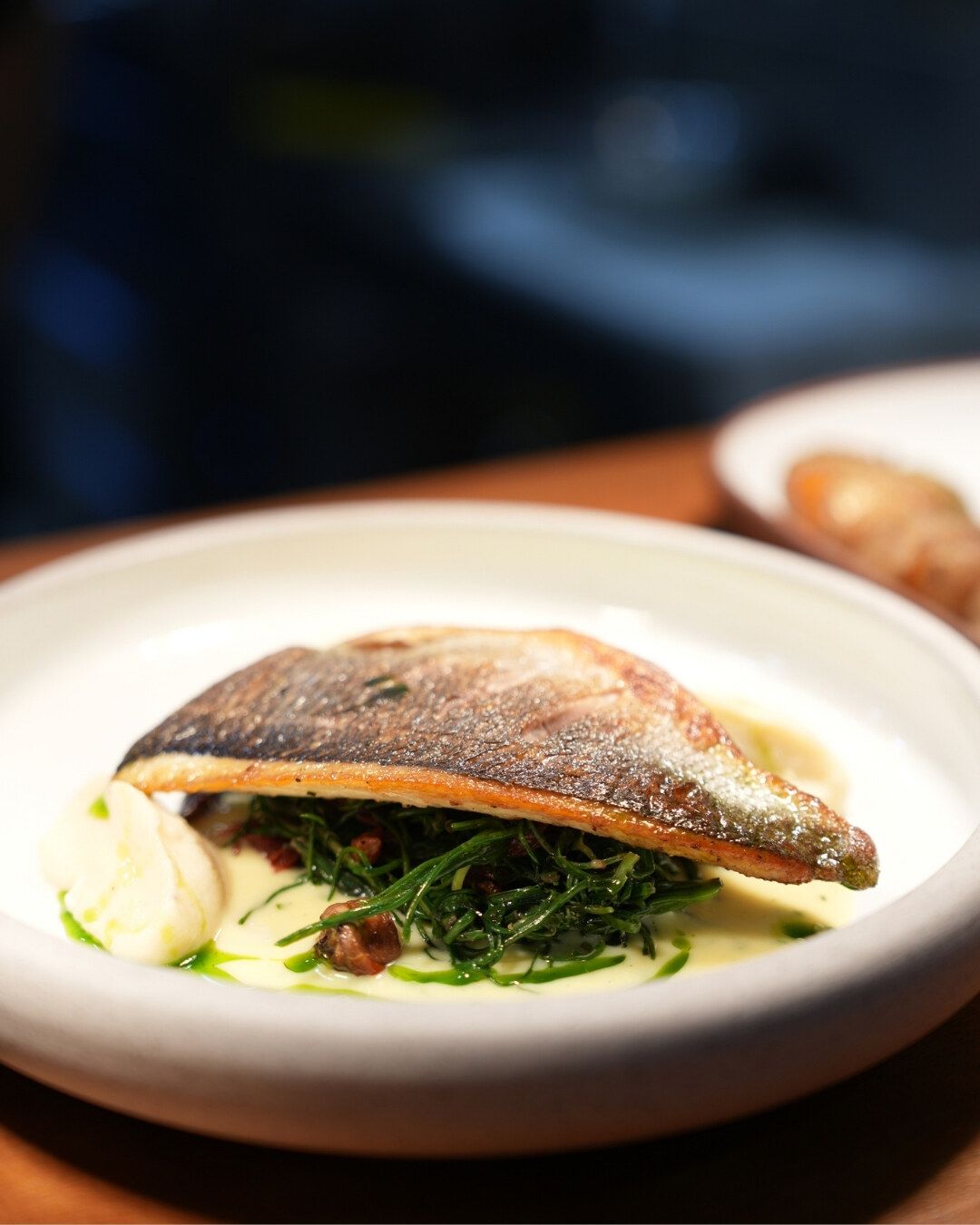 A fillet of fish on greens