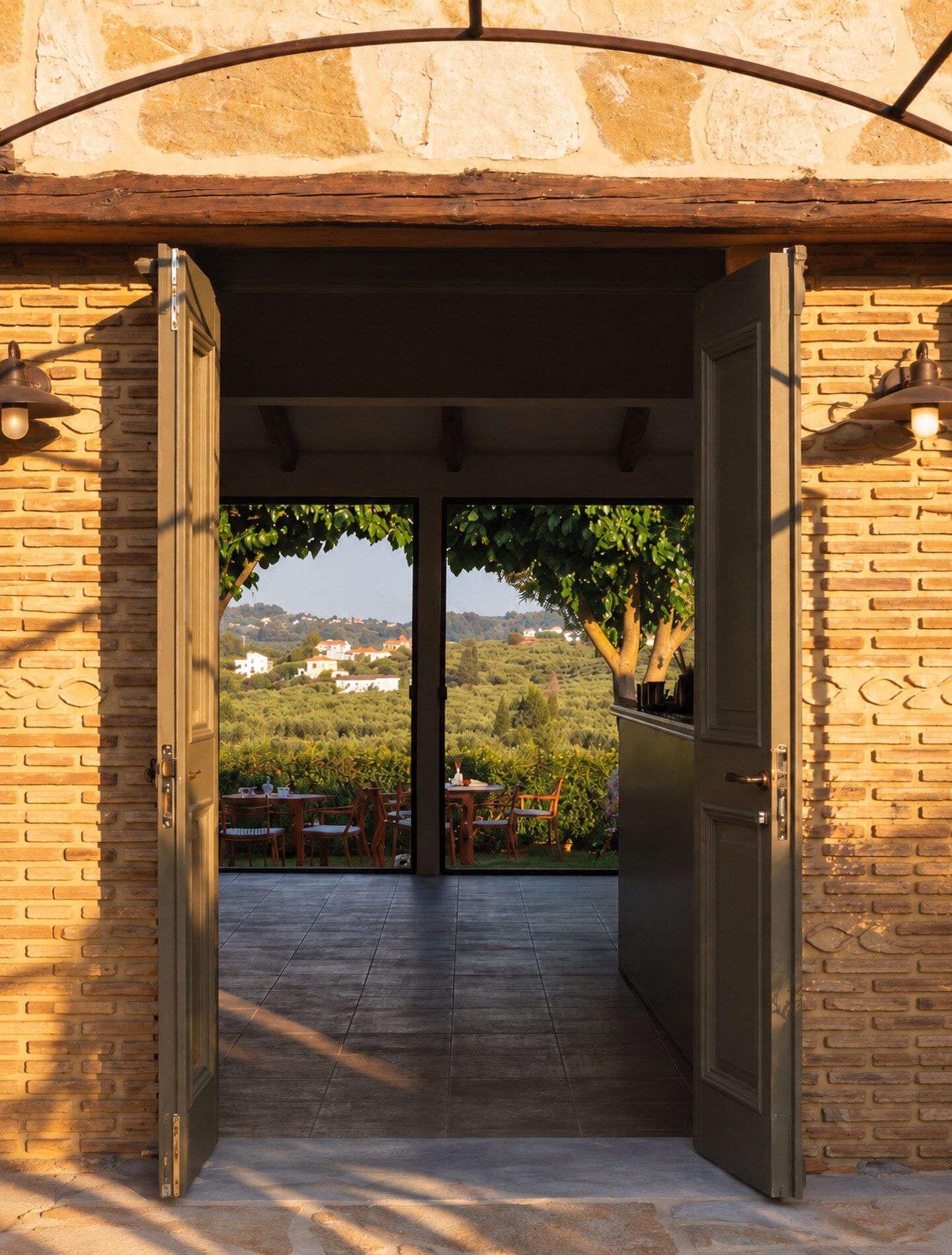 The entrance to Meraki, with the garden beyond the doors