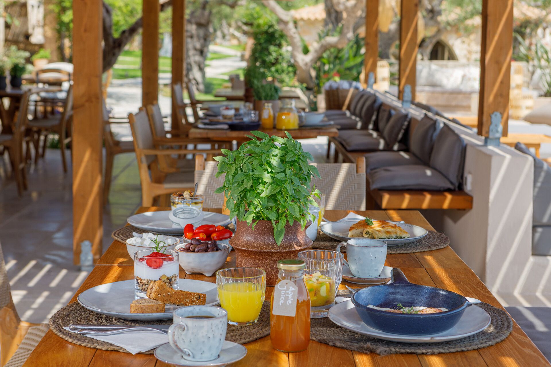 A breakfast table set in the morning sun